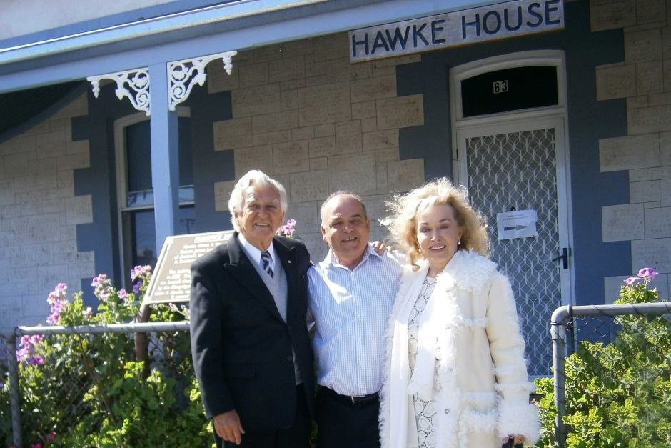 Bob Hawke standing outside his childhood home.